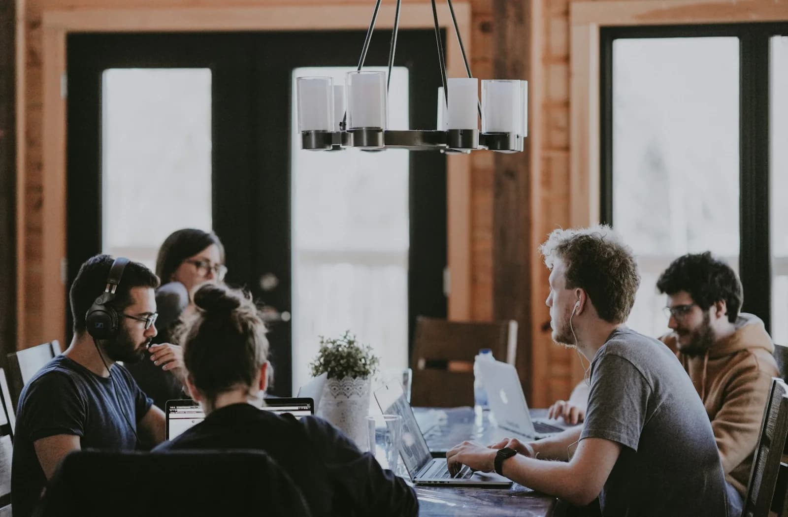 A creative product team collaborating in a bright studio